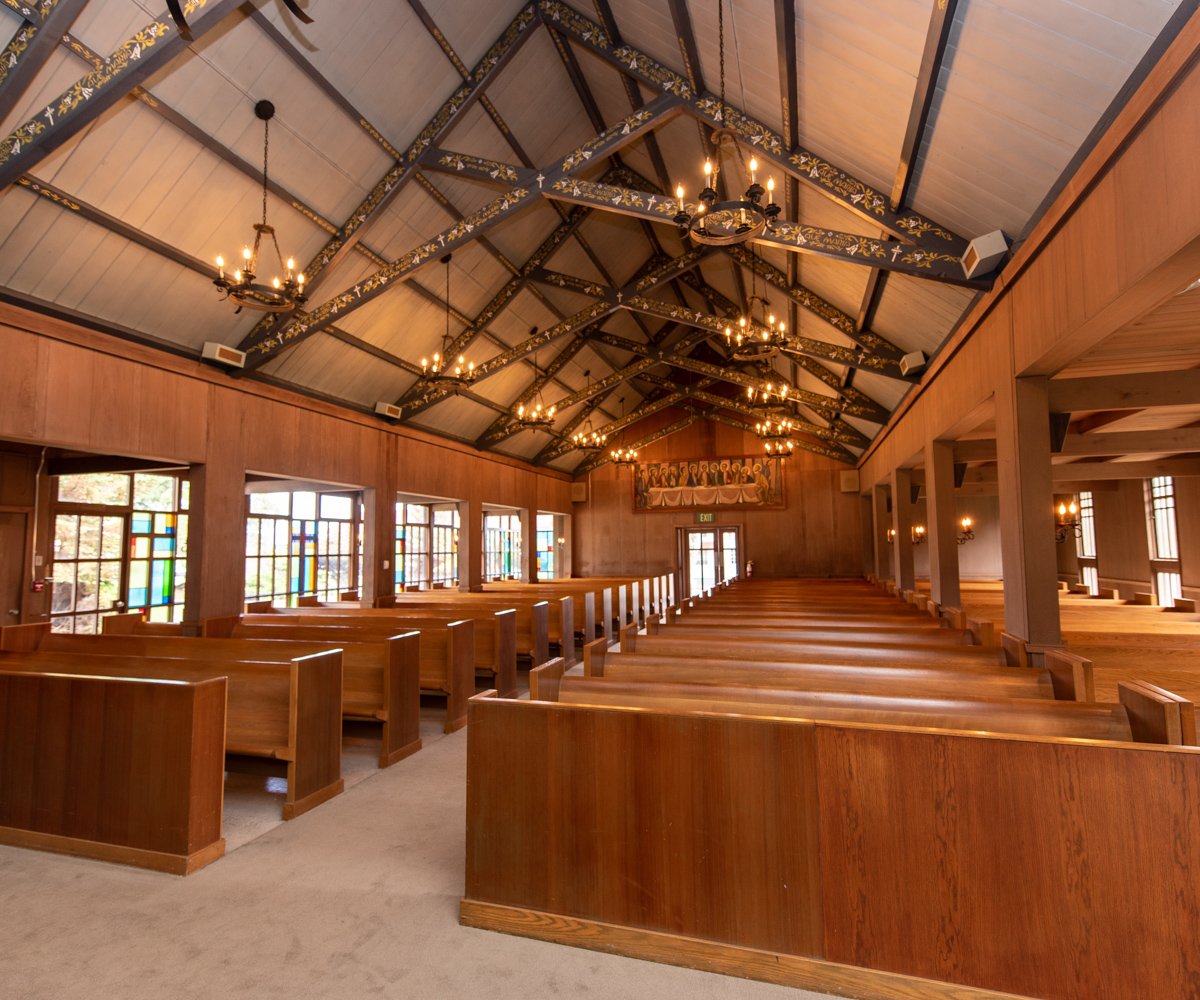 Oak wood church pews and ornate exposed beams in historic church - Chapel of Our Lady at the Presidio - Wedgewood Weddings - 1