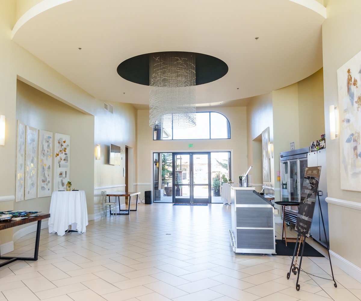 Indoor foyer with bar and entry tables for guests - Evergreen Springs by Wedgewood Weddings - 8