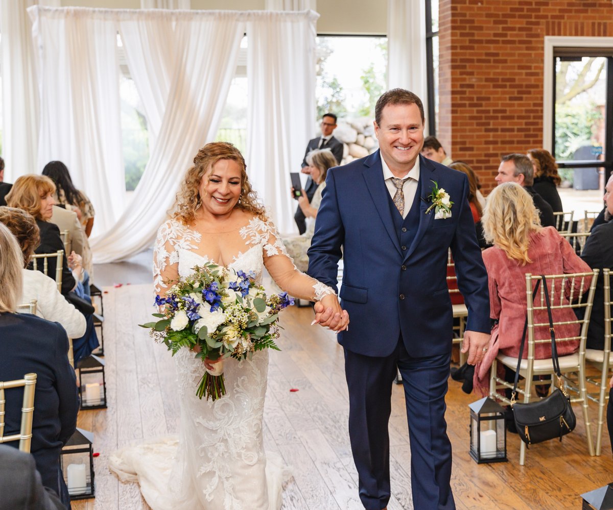 Newlyweds walking down the aisle - Evergreen Springs by Wedgewood Weddings - 4