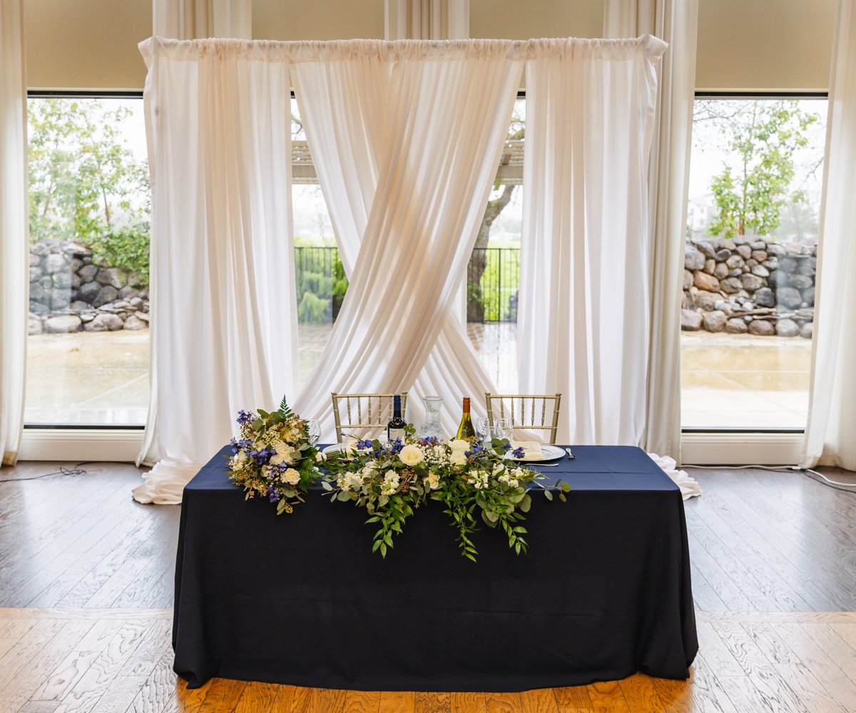 Sweetheart table with navy blue linens against white drapery - Evergreen Springs by Wedgewood Weddings - 5
