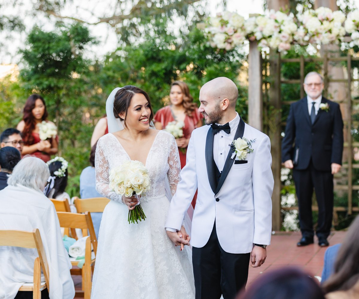 Bride and groom walking down the aisle after their ceremony - Golden Gate Club at the Presidio - Wedgewood Weddings - 4