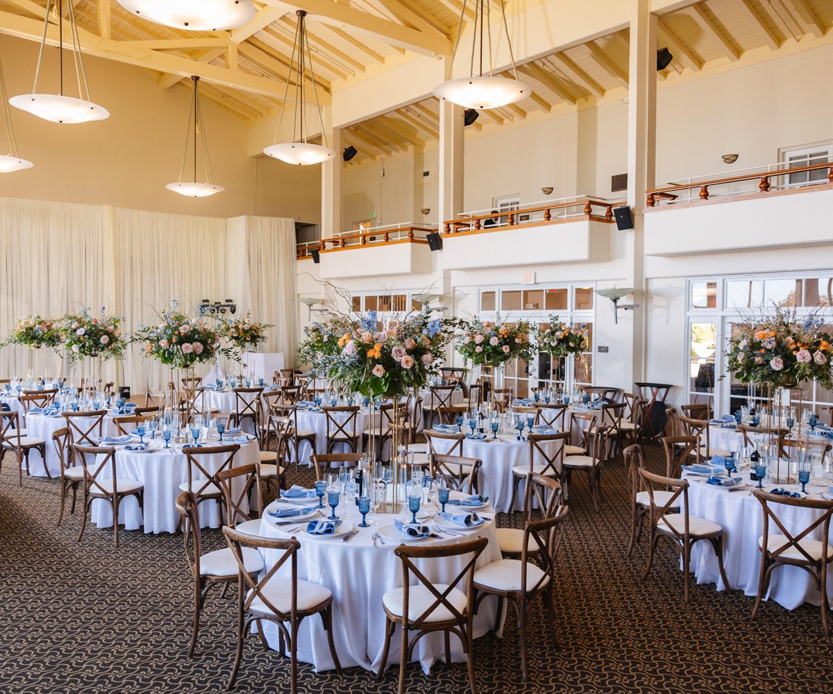 Lavish wedding reception with elaborate florals and silk white table linens - Golden Gate Club at the Presidio - Wedgewood Weddings - 1