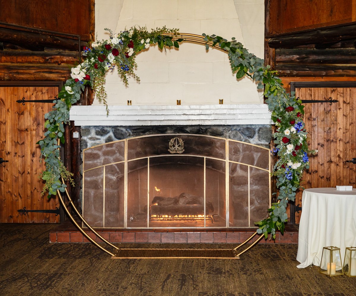 Ceremony arch in front of fireplace - Log Cabin at the Presidio - Wedgewood Weddings - 1