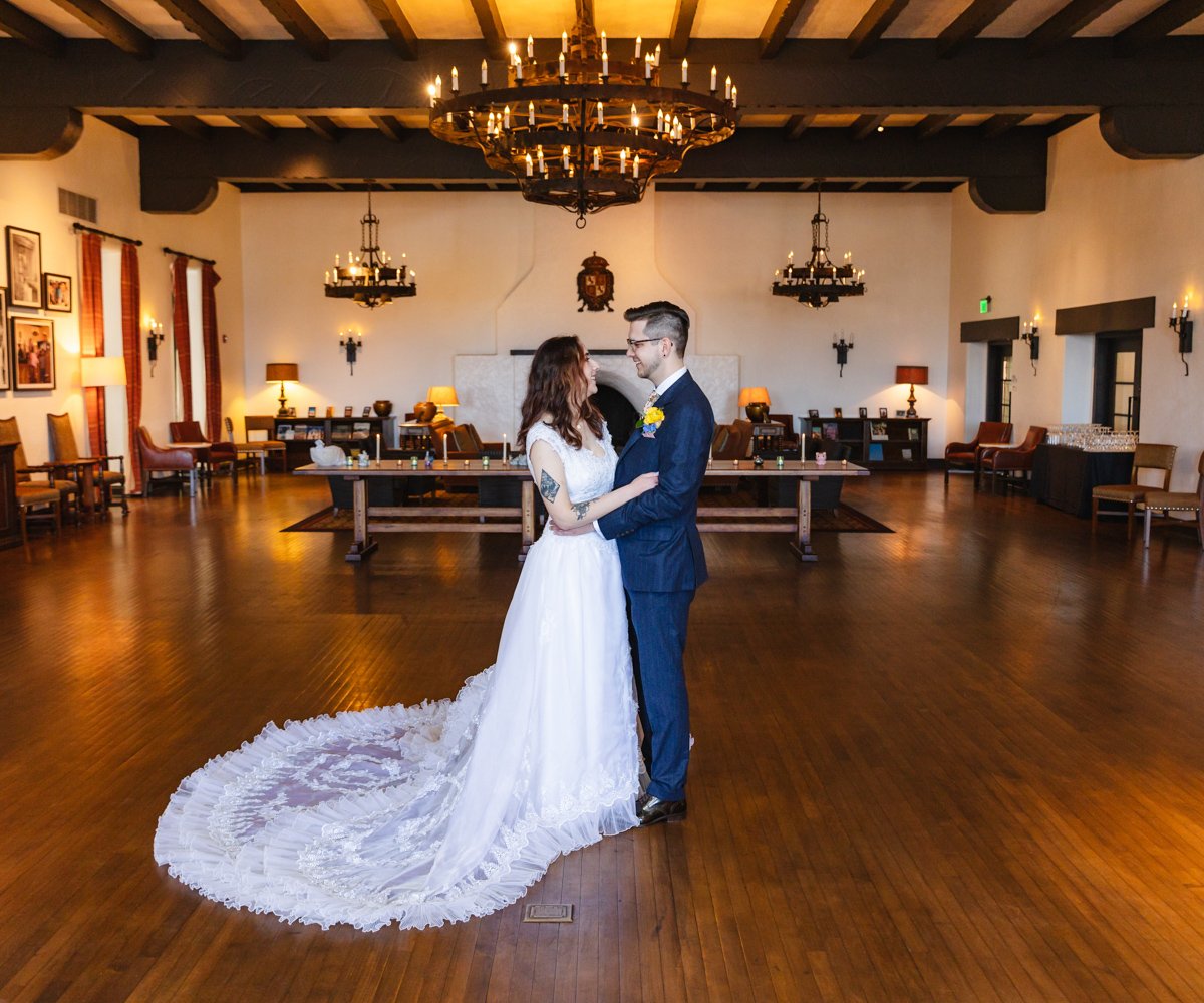 Bride and groom posing in the stately Moraga Hall - Officers Club at the Presidio - Wedgewood Weddings - 1