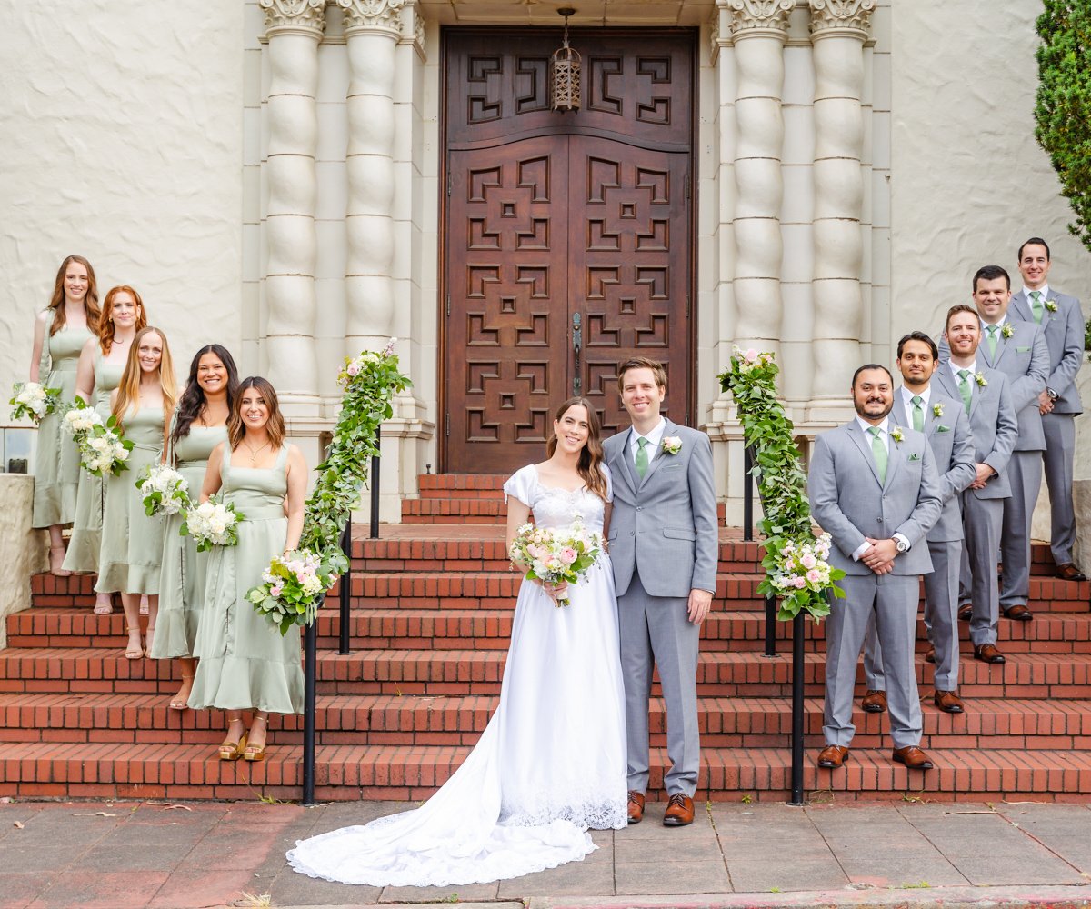 Bridal party posing in front of historic chapel - Presidio Chapel at the Golden Gate Club - Wedgewood Weddings