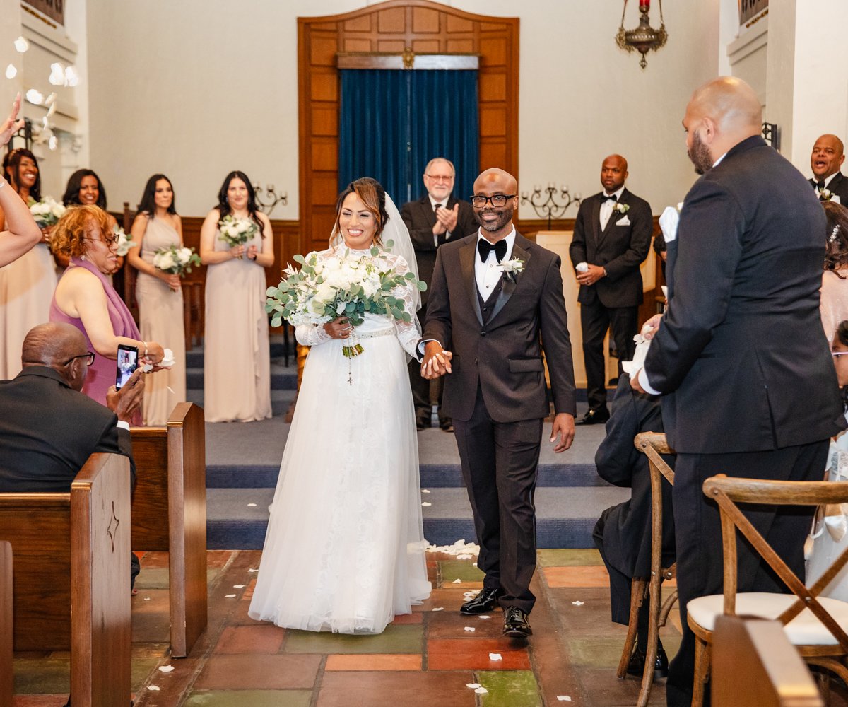 Bride and groom walk down the aisle after saying -I do- in historic chapel - Presidio Chapel at the Golden Gate Club - Wedgewood Weddings