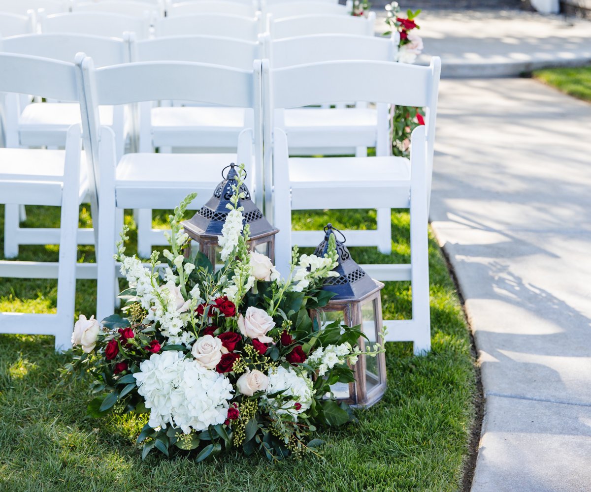 Wedding floral decorations with roses and lanterns - San Ramon Waters by Wedgewood Weddings
