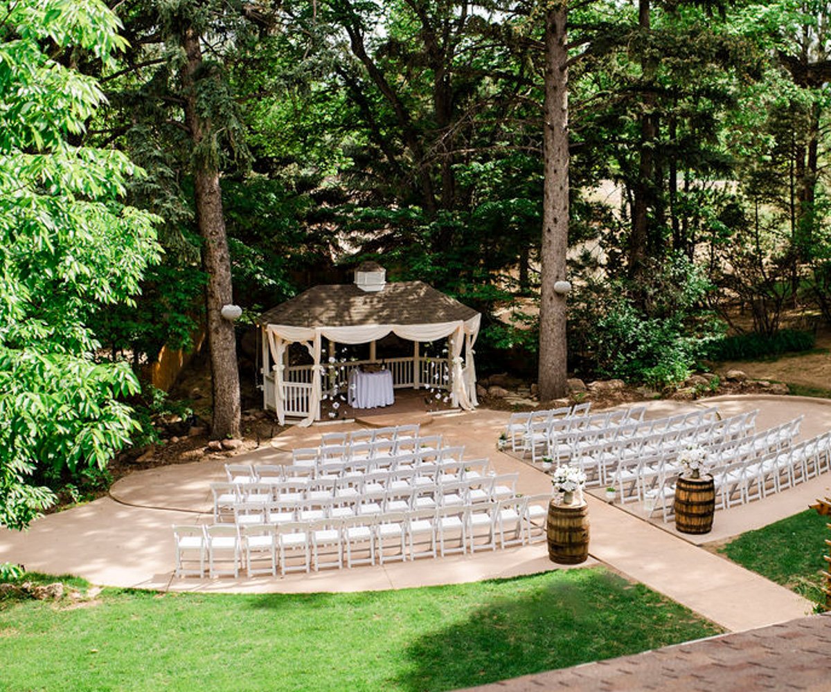 Gazebo ceremony site surrounded by tall trees and lush greenery - Tapestry House by Wedgewood Weddings