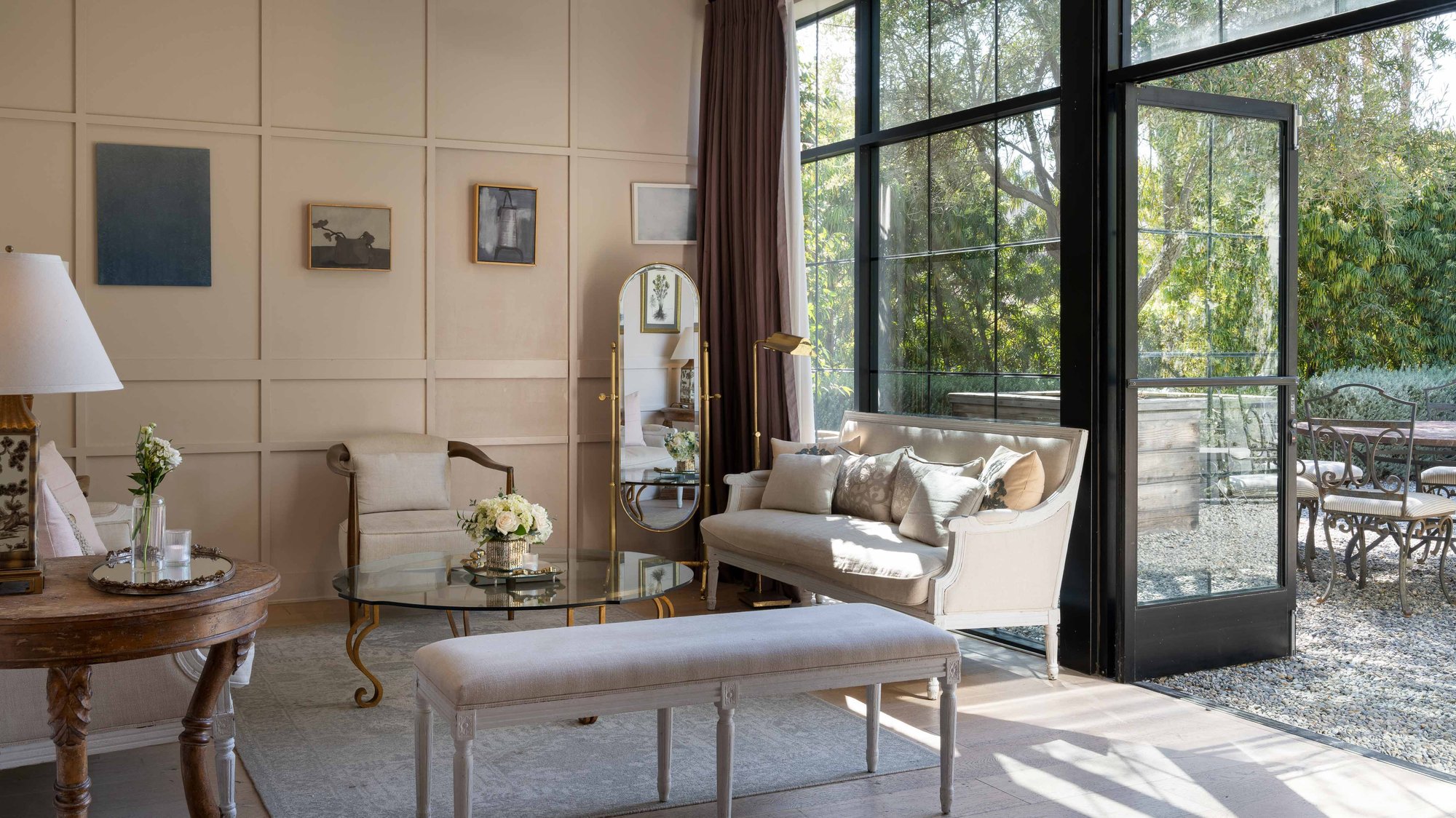 A bright bridal suite with cream furniture and large windows