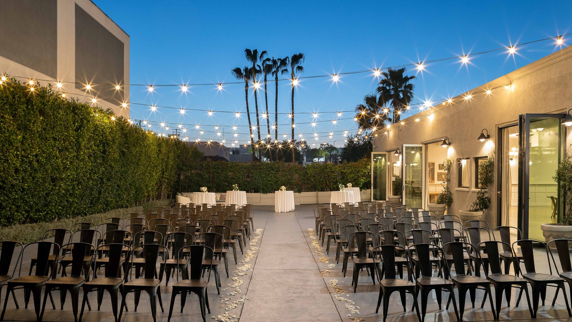 Evening ceremony spaces with string lights creating a romantic ambiance
