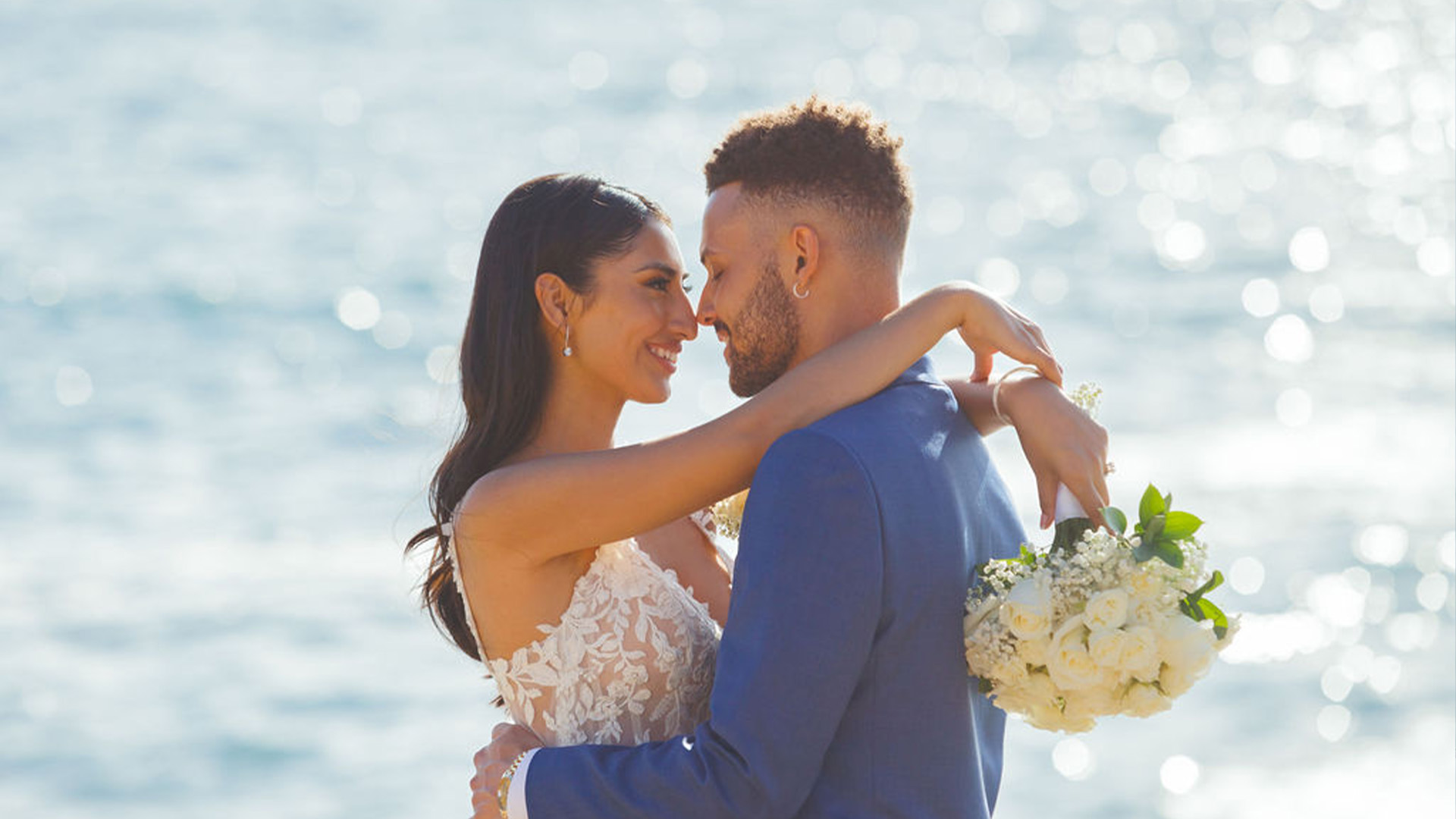 Couple hugging with ocean views